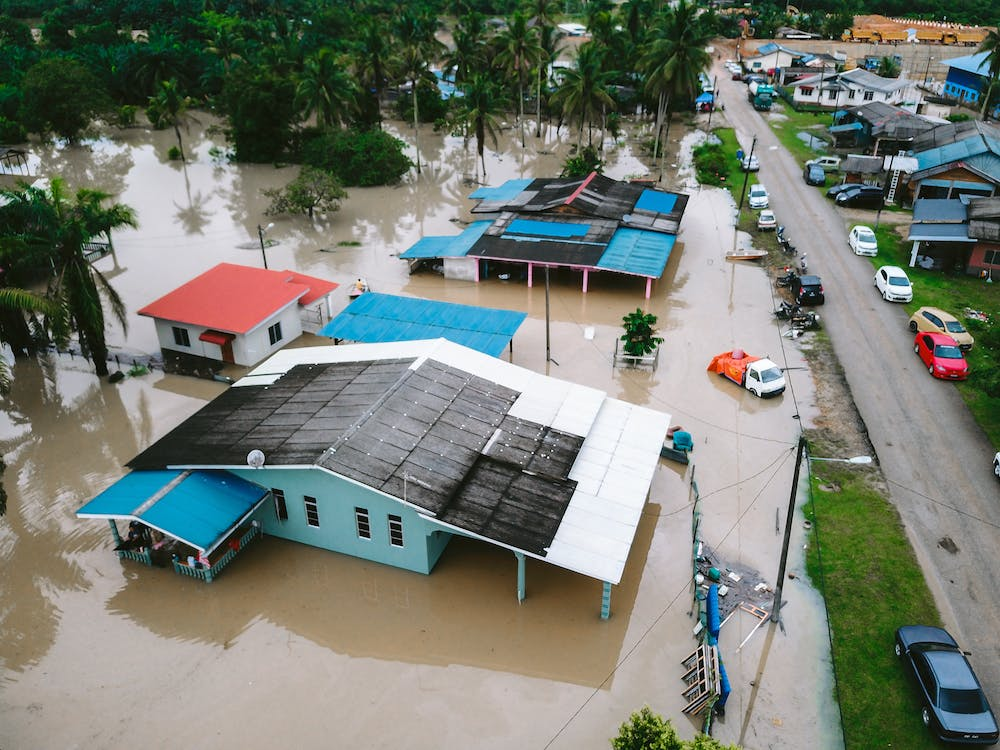 A photo showing an aerial view of a flooded property