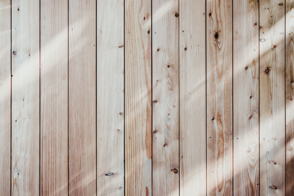 A photo showing wood floorboards.