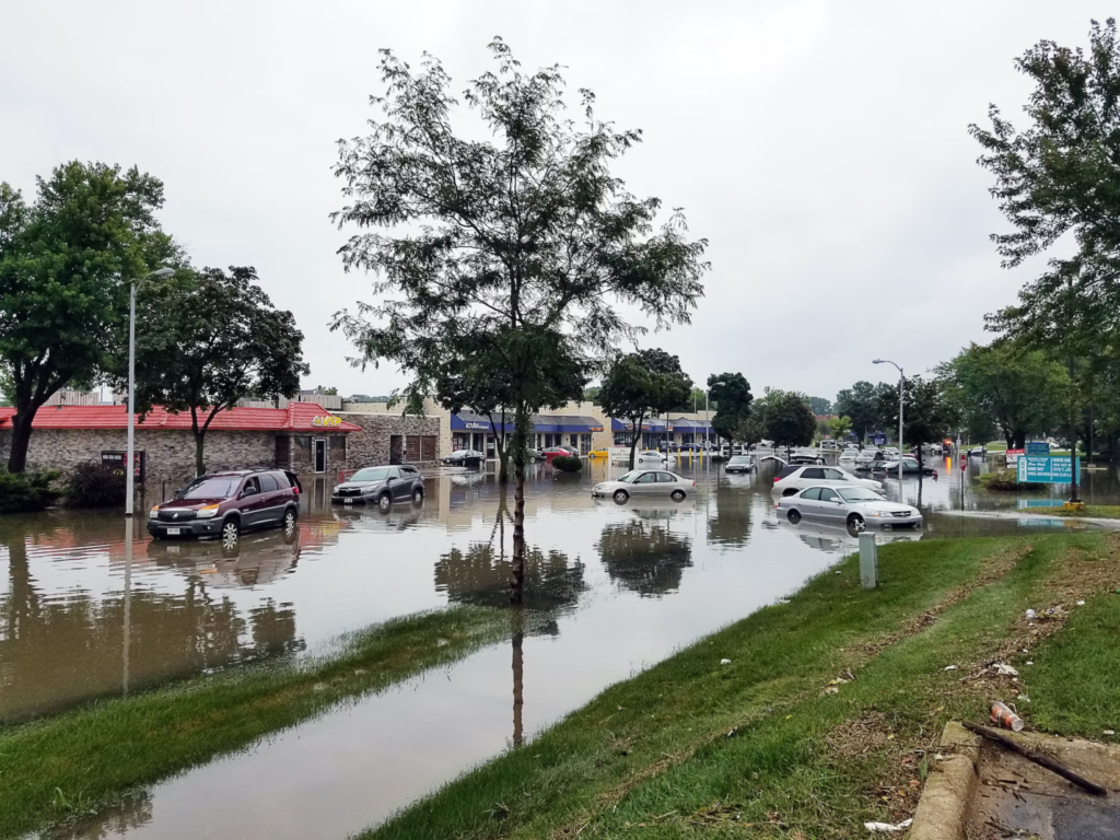 A photo showing cars on a flooded street