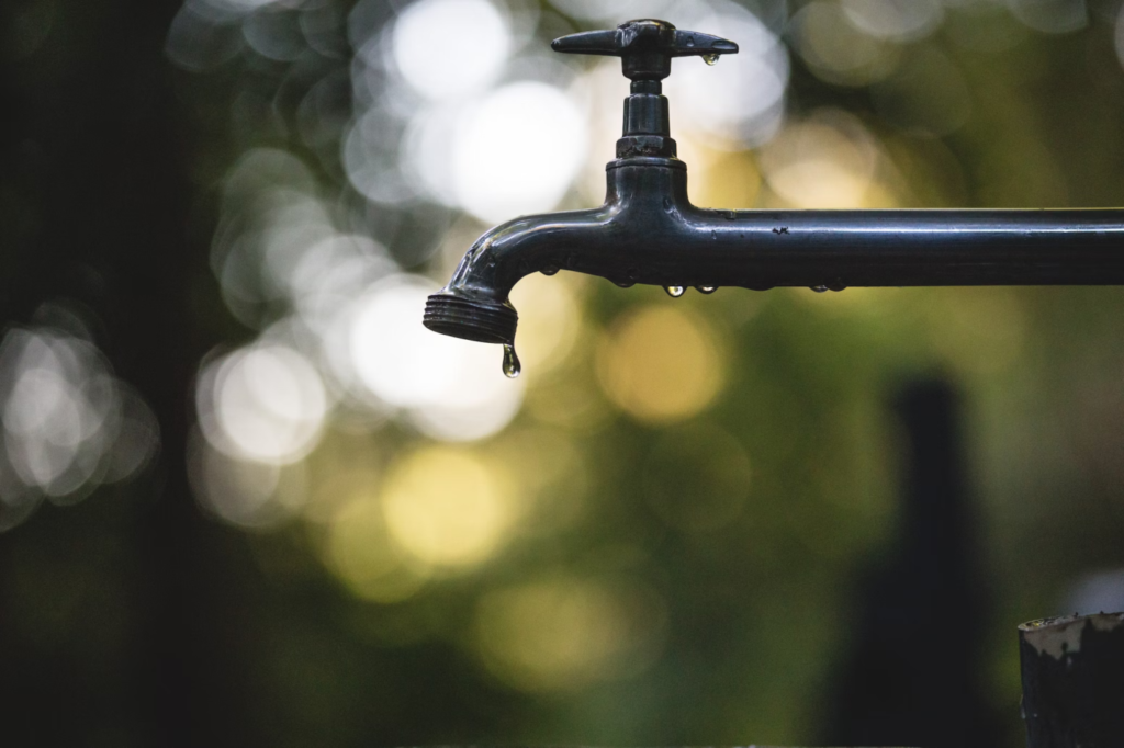 A photo showing a tap with a slow water leak.