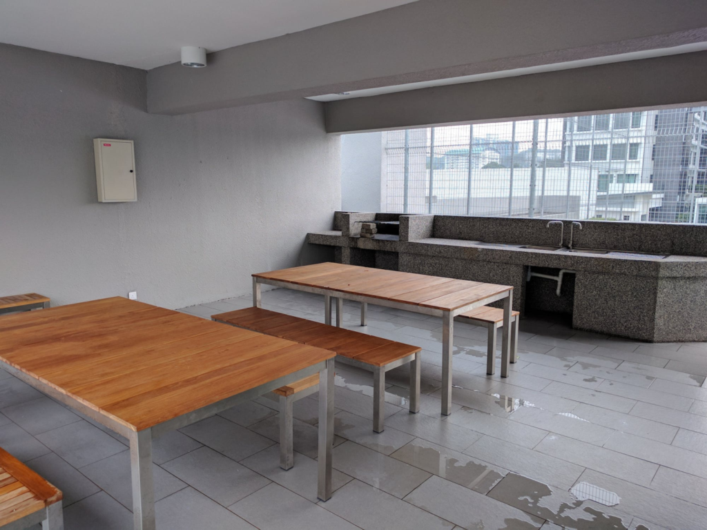 A photo of a room with tables and benches.