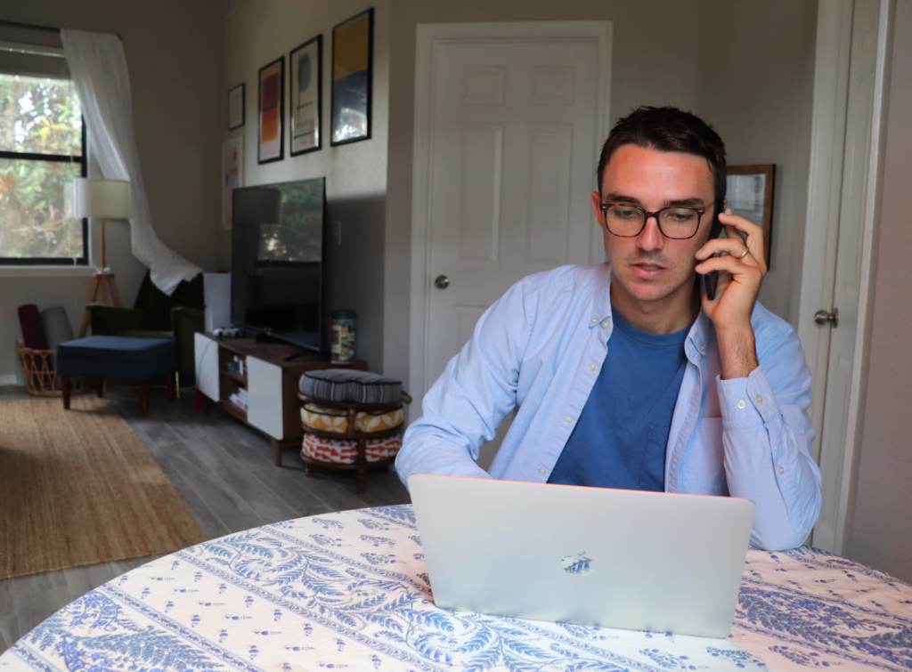 A person calling for help as part of their water damage response strategy.