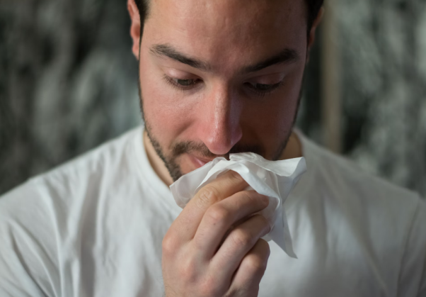 A man facing an allergic reaction.