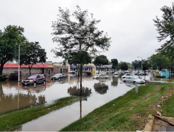 Street in need of emergency water removal services.