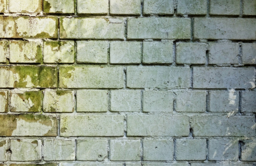 Water damage on a brick wall.