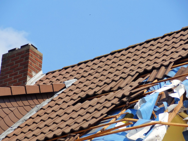 A residential roof damaged by moisture